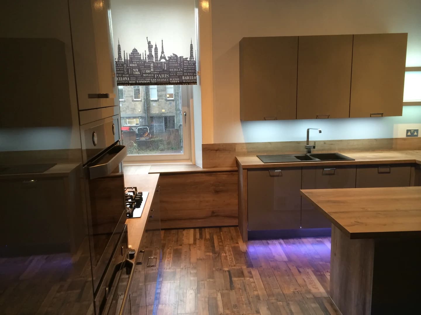 Completed kitchen showing our Vivo Gloass range with grey finish